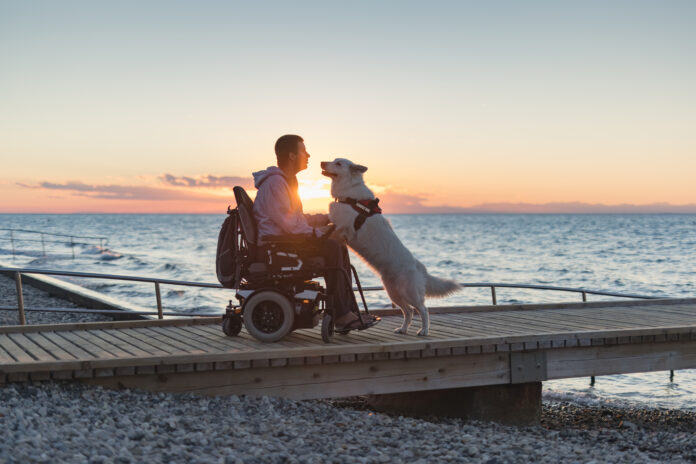 Man with disability with his service dog